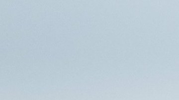 PARIS, FRANCE - JULY 05: Virgil Abloh wears a white shirt, a black tie with 'A Formality' slogan, a black blazer jacket with multicolored buttons embroidered, black flared suit pants, a red ring, a gold watch, butterfly sunglasses, outside Louis Vuitton Parfum hosts dinner at Fondation Louis Vuitton, during Paris Fashion Week - Haute Couture Fall/Winter 2021/2022, on July 05, 2021 in Paris, France. (Photo by Edward Berthelot/Getty Images)