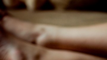 Woman hand into bowl of popcorn. National Popcorn Day