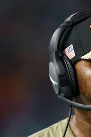 MIAMI GARDENS, FLORIDA - NOVEMBER 11: Head coach Brian Flores of the Miami Dolphins looks on against the Baltimore Ravensat Hard Rock Stadium on November 11, 2021 in Miami Gardens, Florida. (Photo by Michael Reaves/Getty Images)