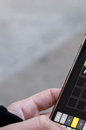 NEW YORK, NEW YORK - JANUARY 12: A friend of the photographer plays "Wordle" on January 12, 2022 in New York City. Created by Josh Wardle, Wordle, which is a spin off his name, is a five letter word guessing game that gives the user six tries to guess the word correctly and is changed daily. It gained traction worldwide in October but recently grew even larger, with more than 2.7 million users according to NPR's Morning Edition. It features a coded way of sharing how many tries a user needed to guess correctly, using a yellow, green, and black square system when sharing it with friends or social media. (Photo by Alexi Rosenfeld/Getty Images)
