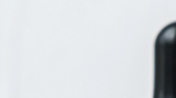 Cannabis CBD oil extracts in jars herb and small beautiful cones. Concept medical marijuana on white background