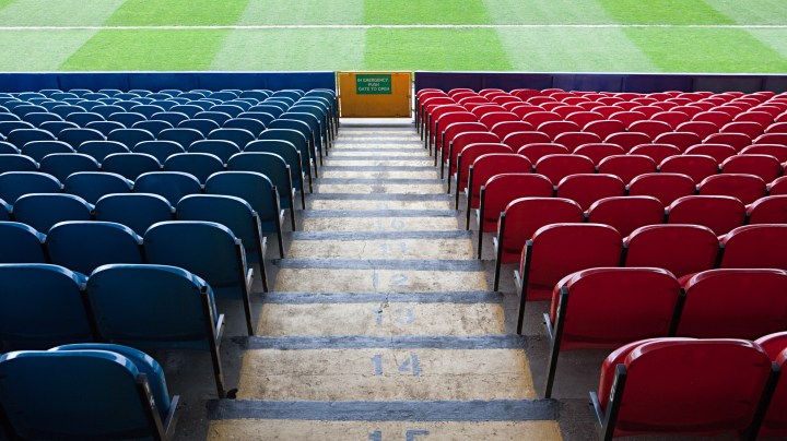 Empty football stadium - stock photo