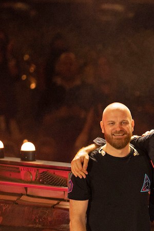 DUBAI, UNITED ARAB EMIRATES - FEBRUARY 15: Will Champion, Chris Martin, Jonny Buckland and Guy Berryman of Coldplay perform live on stage at Al Wasl Plaza on February 15, 2022 in Dubai, United Arab Emirates. (Photo by Shlomi Pinto/Getty Images)