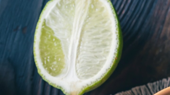 Bowl of guacamole with tortilla chips - stock photo