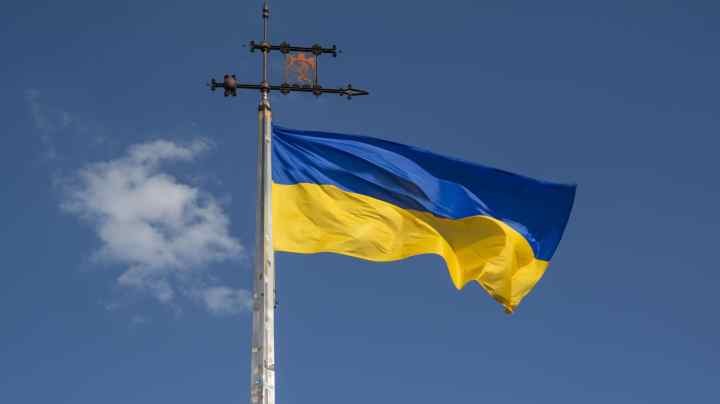 Ukrainian flag with the The coat of arms of the city Lviv,Ukraine for post about Latin American countries speaking in support of Ukraine.
