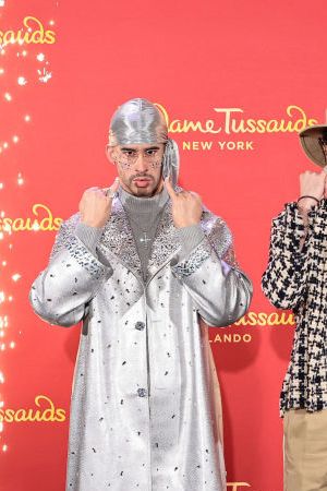 NEW YORK, NEW YORK - APRIL 19: Bad Bunny (C) reveals wax figures for Madame Tussauds New York and Madame Tussauds Orlando at Madame Tussauds on April 19, 2022 in New York City. (Photo by Jamie McCarthy/Getty Images for Madame Tussauds New York)