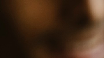 Group of friends toasting beer glasses at table in bar - stock photo