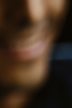 Group of friends toasting beer glasses at table in bar - stock photo