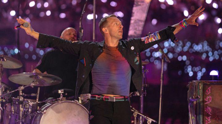 DUBAI, UNITED ARAB EMIRATES - FEBRUARY 15: Will Champion and Chris Martin of Coldplay perform live on stage at Al Wasl Plaza on February 15, 2022 in Dubai, United Arab Emirates. (Photo by Shlomi Pinto/Getty Images)