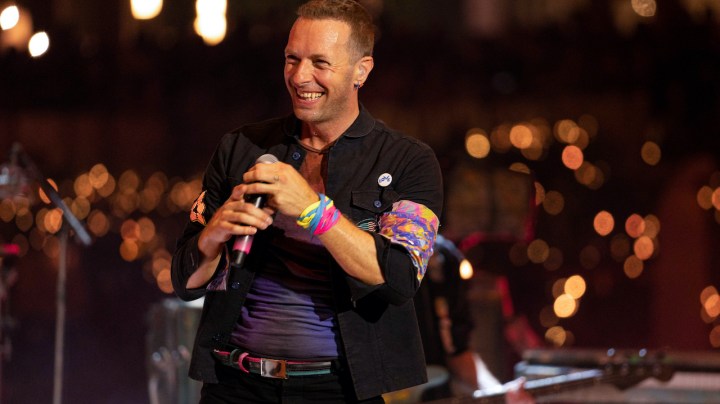 DUBAI, UNITED ARAB EMIRATES - FEBRUARY 15: Chris Martin of Coldplay performs live on stage at Al Wasl Plaza on February 15, 2022 in Dubai, United Arab Emirates. (Photo by Shlomi Pinto/Getty Images)