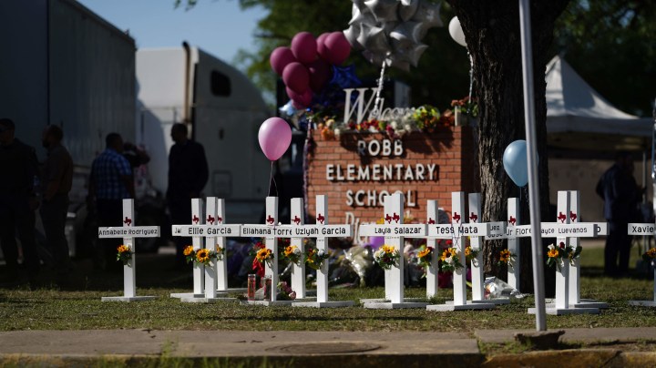 Crosses sit outside the Robb Elementary School in remembrance of those killed on Thursday, in Uvalde, Texas.