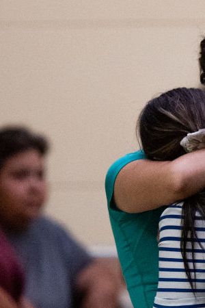 UVALDE, TEXAS - MAY 24: People mourn outside of the SSGT Willie de Leon Civic Center following the mass shooting at Robb Elementary School on May 24, 2022 in Uvalde, Texas. According to reports, 19 students and 2 adults were killed, with the gunman fatally shot by law enforcement. (Photo by Brandon Bell/Getty Images)