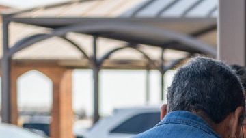 Uvalde community members distribute food to people waiting to donate blood at the South Texas Blood Bank's emergency blood drive on May 25, 2022.