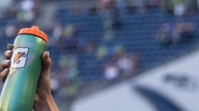 SEATTLE, WA - AUGUST 29: OL Reign Lauren Barnes #3, Sofia Huerta #11, Jessica Fishlock #10 and Megan Rapinoe #15 celebrate after a game between Portland Thorns FC and OL Reign at Lumen Field on August 29, 2021 in Seattle, Washington. (Photo by Stephen Brashear/ISI Photos/Getty Images)