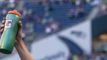 SEATTLE, WA - AUGUST 29: OL Reign Lauren Barnes #3, Sofia Huerta #11, Jessica Fishlock #10 and Megan Rapinoe #15 celebrate after a game between Portland Thorns FC and OL Reign at Lumen Field on August 29, 2021 in Seattle, Washington. (Photo by Stephen Brashear/ISI Photos/Getty Images)