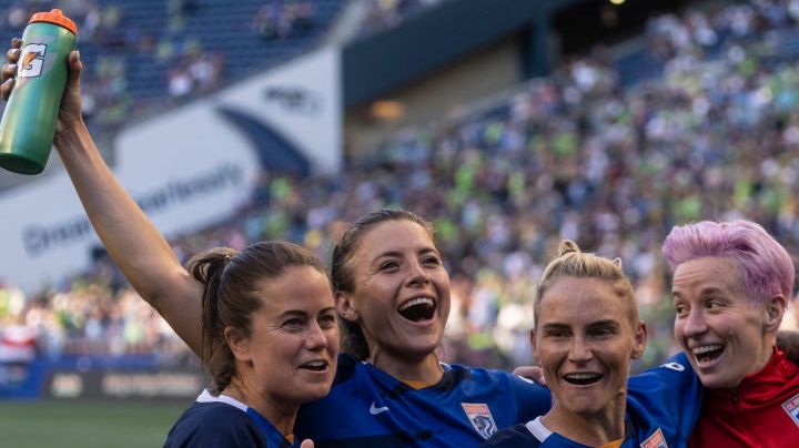 SEATTLE, WA - AUGUST 29: OL Reign Lauren Barnes #3, Sofia Huerta #11, Jessica Fishlock #10 and Megan Rapinoe #15 celebrate after a game between Portland Thorns FC and OL Reign at Lumen Field on August 29, 2021 in Seattle, Washington. (Photo by Stephen Brashear/ISI Photos/Getty Images)