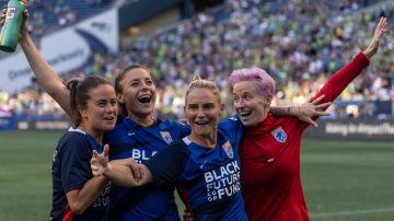 SEATTLE, WA - AUGUST 29: OL Reign Lauren Barnes #3, Sofia Huerta #11, Jessica Fishlock #10 and Megan Rapinoe #15 celebrate after a game between Portland Thorns FC and OL Reign at Lumen Field on August 29, 2021 in Seattle, Washington. (Photo by Stephen Brashear/ISI Photos/Getty Images)