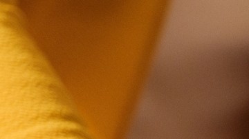 Mexican tamales on christmas table being put by a latin woman.