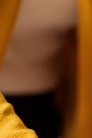 Mexican tamales on christmas table being put by a latin woman.