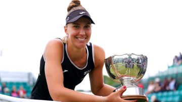 Brazil's Beatriz Haddad Maia celebrates with the trophy after winning her women's singles final match against USA's Alison Riske on centre court on day nine of the Rothesay Open 2022 at Nottingham Tennis Centre, Nottingham. Picture date: Sunday June 12, 2022. (Photo by Tim Goode/PA Images via Getty Images)