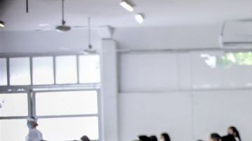 CANCUN, MEXICO - AUGUST 29: Students sit in a classroom as wait to take their entrance exam during an admission exam at CBTIS 111 on August 29, 2020 in Cancun, Mexico. Over 15,000 students sat for their high school admission exams of Quintana Roo. (Photo by Medios y Media/Getty Images)