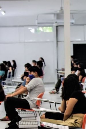 CANCUN, MEXICO - AUGUST 29: Students sit in a classroom as wait to take their entrance exam during an admission exam at CBTIS 111 on August 29, 2020 in Cancun, Mexico. Over 15,000 students sat for their high school admission exams of Quintana Roo. (Photo by Medios y Media/Getty Images)