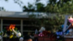 A woman cries at a makeshift memorial at Robb Elementary School in Uvalde, Texas, on May 30, 2022. - Grieving families were to hold the first funerals Tuesday for Texas shooting victims one week after a school massacre left 19 children and two teachers dead, with President Joe Biden vowing to push for stricter US gun regulation.
Mourners attended wakes in the town of Uvalde on Monday for some of the child victims gunned down by a local 18-year-old man who was then killed by police. (Photo by CHANDAN KHANNA / AFP) (Photo by CHANDAN KHANNA/AFP via Getty Images)