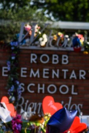A woman cries at a makeshift memorial at Robb Elementary School in Uvalde, Texas, on May 30, 2022. - Grieving families were to hold the first funerals Tuesday for Texas shooting victims one week after a school massacre left 19 children and two teachers dead, with President Joe Biden vowing to push for stricter US gun regulation.
Mourners attended wakes in the town of Uvalde on Monday for some of the child victims gunned down by a local 18-year-old man who was then killed by police. (Photo by CHANDAN KHANNA / AFP) (Photo by CHANDAN KHANNA/AFP via Getty Images)