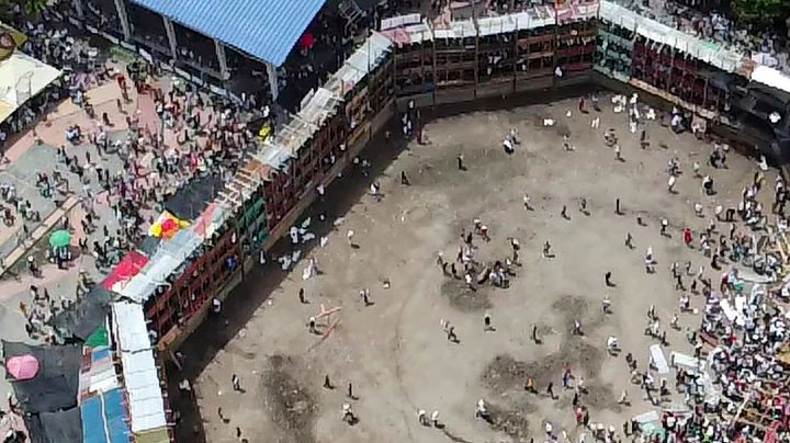 Aerial view of the collapsed grandstand in a bullring in the Colombian municipality of El Espinal, southwest of Bogotá, on June 26, 2022. - At least four people were killed and another 30 seriously injured when a full three-story section of wooden stands filled with spectators collapsed, throwing dozens of people to the ground, during a popular event at which members of the public face off with small bulls, officials said. (Photo by SAMUEL ANTONIO GALINDO CAMPOS / AFP) (Photo by SAMUEL ANTONIO GALINDO CAMPOS/AFP via Getty Images)