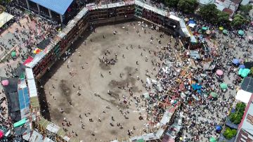 Aerial view of the collapsed grandstand in a bullring in the Colombian municipality of El Espinal, southwest of Bogotá, on June 26, 2022. - At least four people were killed and another 30 seriously injured when a full three-story section of wooden stands filled with spectators collapsed, throwing dozens of people to the ground, during a popular event at which members of the public face off with small bulls, officials said. (Photo by SAMUEL ANTONIO GALINDO CAMPOS / AFP) (Photo by SAMUEL ANTONIO GALINDO CAMPOS/AFP via Getty Images)