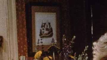 Actor Tony Danza eavesdrops as Judith Light speaks on the telephone, in a still from the TV series, 'Who's The Boss,' circa 1986. (Photo by ABC Television/Fotos International/Getty Images)