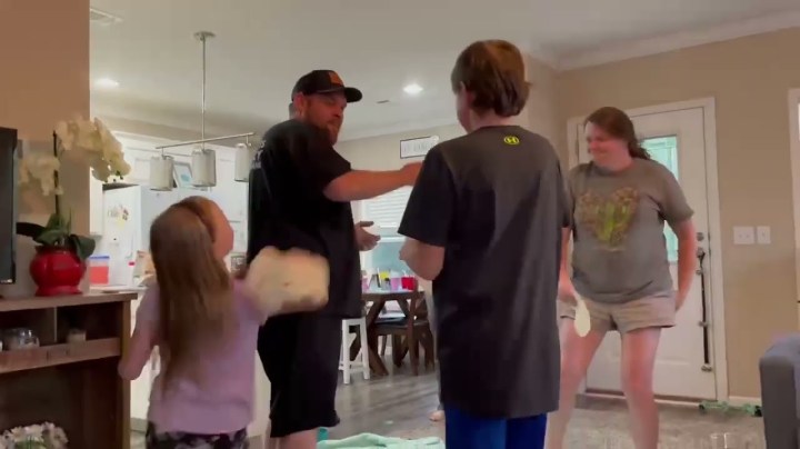 Family slapping each other with tortilla.
