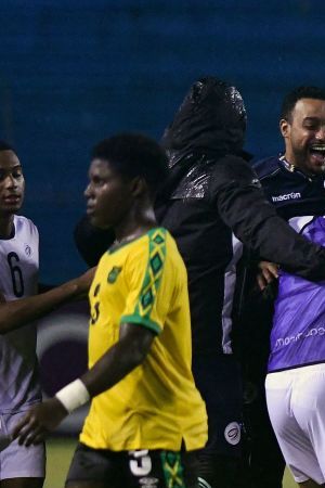 Dominican Republic's team members celebrate after winning the Concacaf U-20 World Cup quarterfinal football match against Jamaica at the Olimpico Metropolitano stadium in San Pedro Sula, Honduras, on June 29, 2022. (Photo by Orlando SIERRA / AFP) (Photo by ORLANDO SIERRA/AFP via Getty Images)