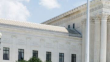 WASHINGTON, DC - JULY 19: Rep. Alexandria Ocasio-Cortez (D-NY) is detained by U.S. Capitol Police Officers after participating in a sit in with activists from Center for Popular Democracy Action (CPDA) in front of the U.S. Supreme Court Building on July 19, 2022 in Washington, DC. The CPDA held the protest with House Democrats in support of abortion rights. (Photo by Anna Moneymaker/Getty Images)