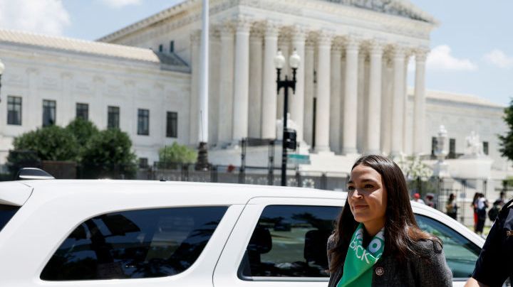 WASHINGTON, DC - JULY 19: Rep. Alexandria Ocasio-Cortez (D-NY) is detained by U.S. Capitol Police Officers after participating in a sit in with activists from Center for Popular Democracy Action (CPDA) in front of the U.S. Supreme Court Building on July 19, 2022 in Washington, DC. The CPDA held the protest with House Democrats in support of abortion rights. (Photo by Anna Moneymaker/Getty Images)