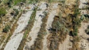 TOPSHOT - Aerial view taken on August 1, 2022, showing a large sinkhole that appeared over the weekend near the mining town of Tierra Amarilla, Copiapo Province, in the Atacama Desert in Chile. - A 100-metre security perimeter has been erected around the hole which appeared in the Tierra Amarilla municipality near the Alcaparrosa mine operated by Canadian firm Lundin Mining. (Photo by JOHAN GODOY / AFP) (Photo by JOHAN GODOY/AFP via Getty Images)