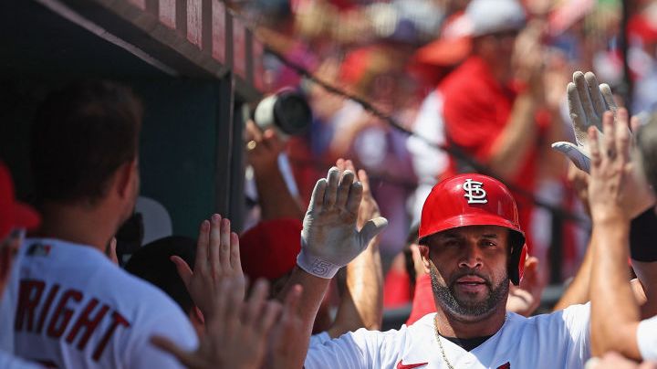 ST LOUIS, MO - AUGUST 18: Albert Pujols #5 of the St. Louis Cardinals his congratulated by teammates after hitting a grand slam against the Colorado Rockies in the third inning at Busch Stadium on August 18, 2022 in St Louis, Missouri. (Photo by Dilip Vishwanat/Getty Images)