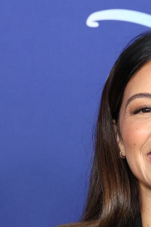 Gina Rodriguez on Disney red carpet.