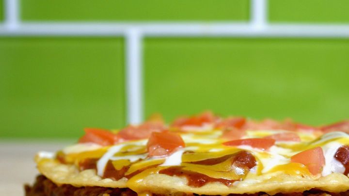 IRVINE, CA - SEPTEMBER 12:  Taco Bell's Mexican Pizza remains a popular item and menu staple.  (Photo by Joshua Blanchard/Getty Images for Taco Bell)