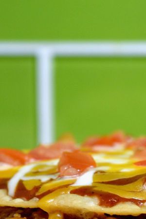 IRVINE, CA - SEPTEMBER 12:  Taco Bell's Mexican Pizza remains a popular item and menu staple.  (Photo by Joshua Blanchard/Getty Images for Taco Bell)