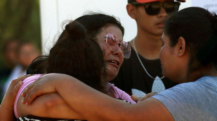Relatives of a miner cry following a collapse at a coal mine which left -up to now- nine miners trapped, in the Agujita area, Sabinas municipality, Coahuila state, Mexico, on August 3, 2022. (Photo by Marcos Gonzalez / AFP) (Photo by MARCOS GONZALEZ/AFP via Getty Images)
