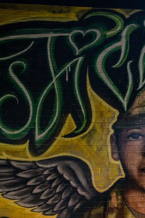 AUSTIN, TX - JULY 06: Flowers adorn a mural of Vanessa Guillen, a soldier based at nearby Fort Hood on July 6, 2020 in Austin, Texas. A suspect in the disappearance of Guillen, whose remains were found in a shallow grave, faced a judge Monday morning. (Photo by Sergio Flores/Getty Images)