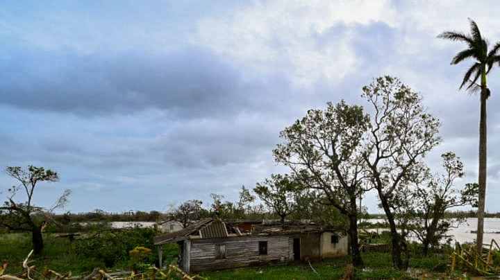 A damaged house is seen in San Juan y Martinez, Pinar del Rio Province, Cuba after the passage of Hurricane Ian, on September 27, 2022. - Powerful Hurricane Ian left a trail of destruction after battering western Cuba on Tuesday, while Florida battened down in preparation for a dangerous direct hit as the strengthening storm churns north. (Photo by ADALBERTO ROQUE / AFP) (Photo by ADALBERTO ROQUE/AFP via Getty Images)