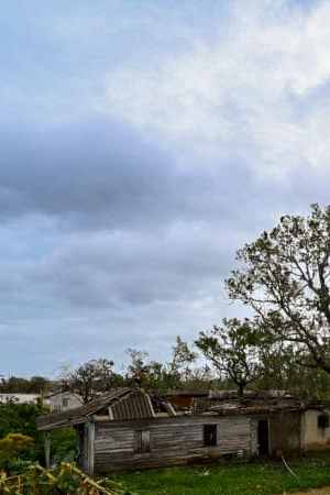 A damaged house is seen in San Juan y Martinez, Pinar del Rio Province, Cuba after the passage of Hurricane Ian, on September 27, 2022. - Powerful Hurricane Ian left a trail of destruction after battering western Cuba on Tuesday, while Florida battened down in preparation for a dangerous direct hit as the strengthening storm churns north. (Photo by ADALBERTO ROQUE / AFP) (Photo by ADALBERTO ROQUE/AFP via Getty Images)