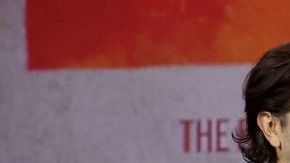 ANAHEIM, CALIFORNIA - SEPTEMBER 10: (L-R) Diego Luna and Adria Arjona speak onstage during D23 Expo 2022 at Anaheim Convention Center in Anaheim, California on September 10, 2022. (Photo by Jesse Grant/Getty Images for Disney)