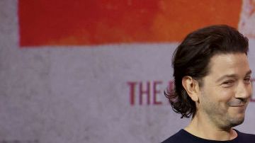ANAHEIM, CALIFORNIA - SEPTEMBER 10: (L-R) Diego Luna and Adria Arjona speak onstage during D23 Expo 2022 at Anaheim Convention Center in Anaheim, California on September 10, 2022. (Photo by Jesse Grant/Getty Images for Disney)