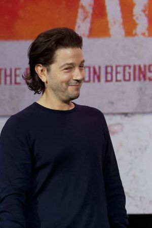 ANAHEIM, CALIFORNIA - SEPTEMBER 10: (L-R) Diego Luna and Adria Arjona speak onstage during D23 Expo 2022 at Anaheim Convention Center in Anaheim, California on September 10, 2022. (Photo by Jesse Grant/Getty Images for Disney)