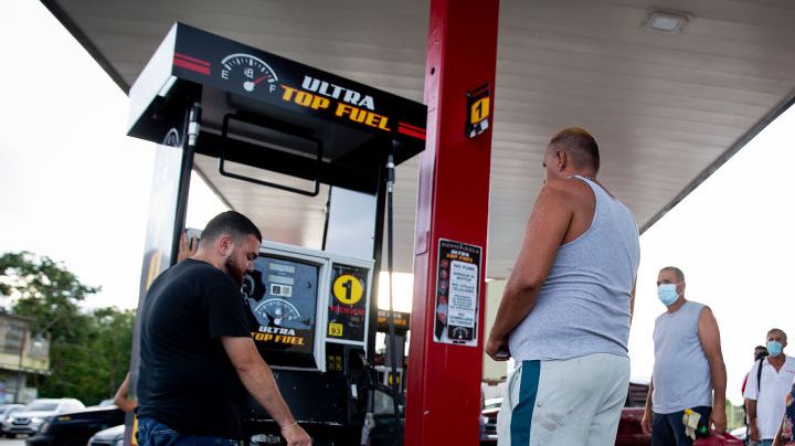CABO ROJO, PUERTO RICO - SEPTEMBER 20:  People wait in line at the Top Fuel gas station to fill their tanks on September 20, 2022 in Cabo Rojo, Puerto Rico. The island awoke to a general island power outage after Hurricane Fiona struck this caribbean nation two days ago. Most people are relying on generator to power their homes and businesses. (Photo by Jose Jimenez/Getty Images)