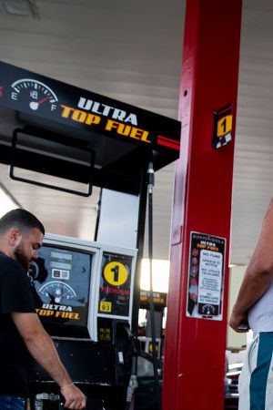 CABO ROJO, PUERTO RICO - SEPTEMBER 20:  People wait in line at the Top Fuel gas station to fill their tanks on September 20, 2022 in Cabo Rojo, Puerto Rico. The island awoke to a general island power outage after Hurricane Fiona struck this caribbean nation two days ago. Most people are relying on generator to power their homes and businesses. (Photo by Jose Jimenez/Getty Images)