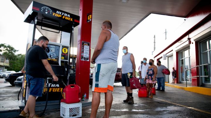 CABO ROJO, PUERTO RICO - SEPTEMBER 20:  People wait in line at the Top Fuel gas station to fill their tanks on September 20, 2022 in Cabo Rojo, Puerto Rico. The island awoke to a general island power outage after Hurricane Fiona struck this caribbean nation two days ago. Most people are relying on generator to power their homes and businesses. (Photo by Jose Jimenez/Getty Images)
